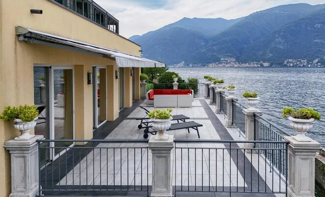 Lakefront contemporary villa with a home cinema and a private dock within the prestigious Bellagio Lake Resort