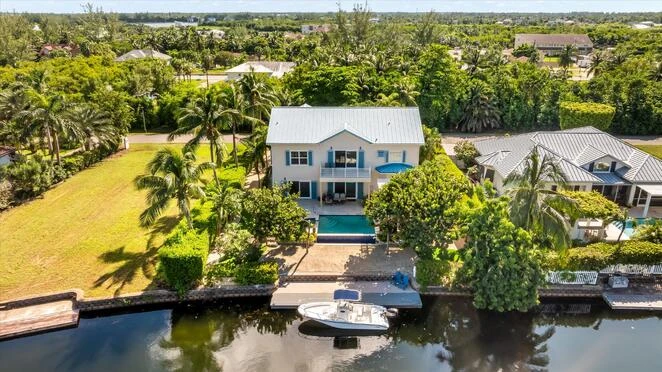 Canalfront house within the prestigious gated community of Bimini Drive in Grand Harbour